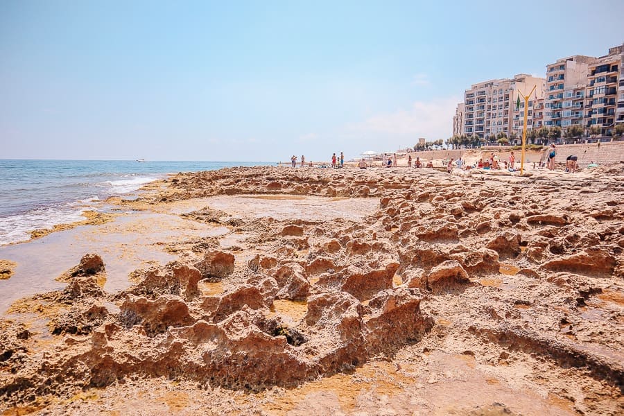 A rocky beach in the city of Sliema, Malta