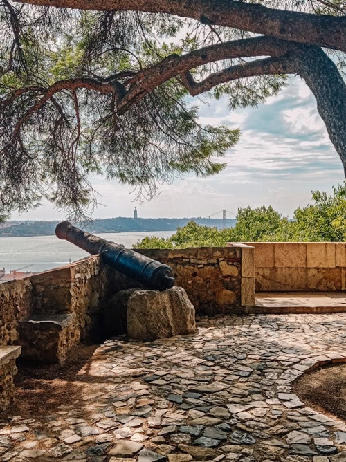 A canon overlooking the river in the Sao Jorge Castle in Lisbon