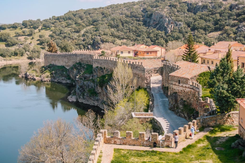 Houses, river, and wall views of the Spanish village Buitrago del Lozoya