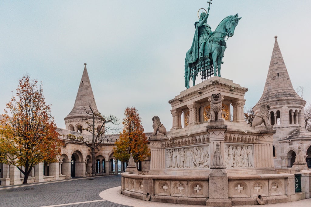 Fisherman Bastion with a statue in front in Budapest